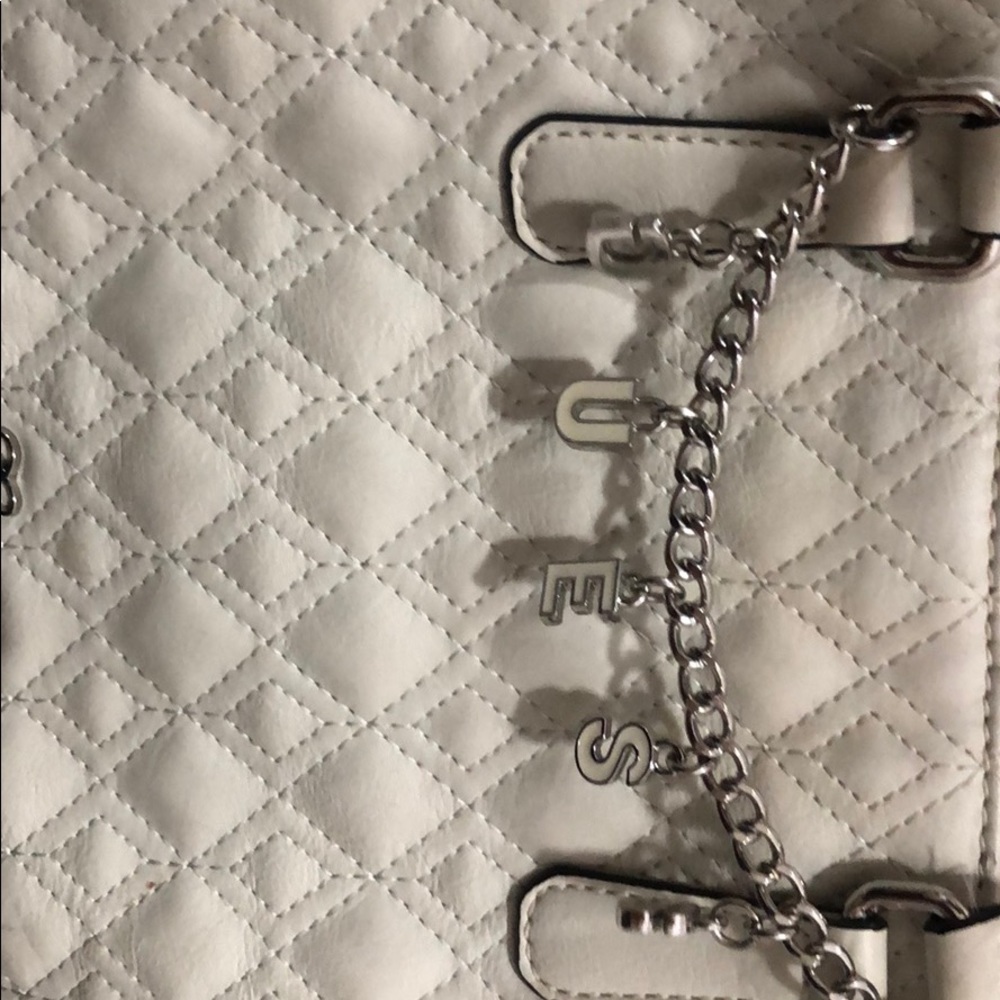 A purse from the company Guess